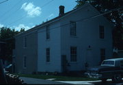 112 6TH AVE, a Greek Revival house, built in New Glarus, Wisconsin in 1859.