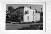 102-104 HOTEL ST, a Commercial Vernacular small retail building, built in Brooklyn, Wisconsin in 1909.