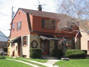 1457 S 85TH ST, a Dutch Colonial Revival house, built in West Allis, Wisconsin in 1941.