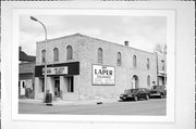 4 N BRIDGE ST, a Commercial Vernacular small retail building, built in Markesan, Wisconsin in 1875.