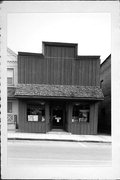 115 N 4TH ST, a Commercial Vernacular small retail building, built in Watertown, Wisconsin in 1867.