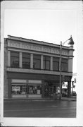 301 E MAIN ST, a Romanesque Revival retail building, built in Watertown, Wisconsin in 1876.