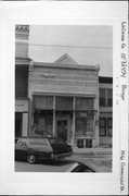 1516 COMMERCIAL ST, a Queen Anne retail building, built in Bangor, Wisconsin in 1891.