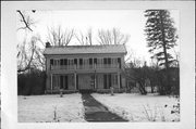 99 E JEFFERSON ST, a Greek Revival house, built in West Salem, Wisconsin in 1859.