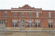 2219 SOUTH AVE, a Romanesque Revival livery/stable, built in La Crosse, Wisconsin in 1902.