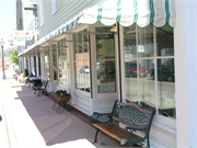 211 W WATER ST, a Front Gabled large retail building, built in Shullsburg, Wisconsin in 1842.