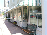 211 W WATER ST, a Front Gabled retail building, built in Shullsburg, Wisconsin in 1842.