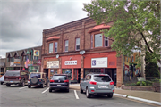 210-214 WALNUT ST, a Commercial Vernacular large retail building, built in Spooner, Wisconsin in 1905.