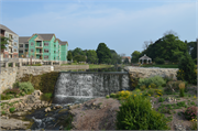 ON MENOMONEE RIVER NEAR MAIN ST AND WATER ST INTERSECTION, a NA (unknown or not a building) dam/lock, built in Menomonee Falls, Wisconsin in 1954.