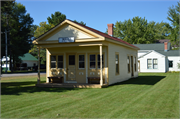 NW CORNER OF WASHINGTON AVE AND WILLOW DR (HERITAGE PARK), a Greek Revival post office, built in Plover, Wisconsin in 1870.