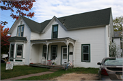902 6TH ST E, a Gabled Ell house, built in Menomonie, Wisconsin in 1875.