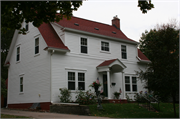 114 12TH ST SE, a Colonial Revival/Georgian Revival house, built in Menomonie, Wisconsin in 1923.