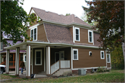 1109 3RD AVE E, a Dutch Colonial Revival house, built in Menomonie, Wisconsin in 1907.