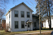 1021 8TH ST E, a Gabled Ell house, built in Menomonie, Wisconsin in 1890.