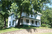 209 ORANGE ST, a Colonial Revival/Georgian Revival house, built in Hudson, Wisconsin in 1900.