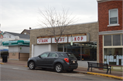 120 W Blackhawk Ave, a Commercial Vernacular small retail building, built in Prairie du Chien, Wisconsin in 1957.