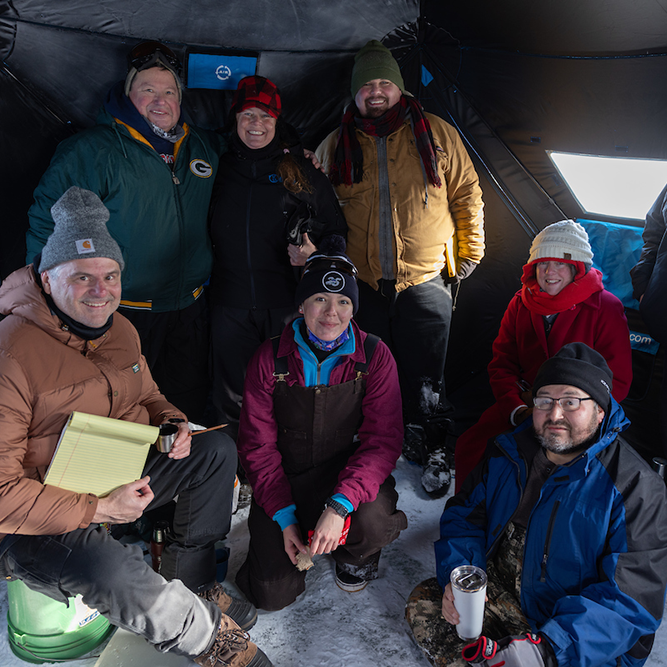 Jim and the team are bundled up in the tent excited to start the day.