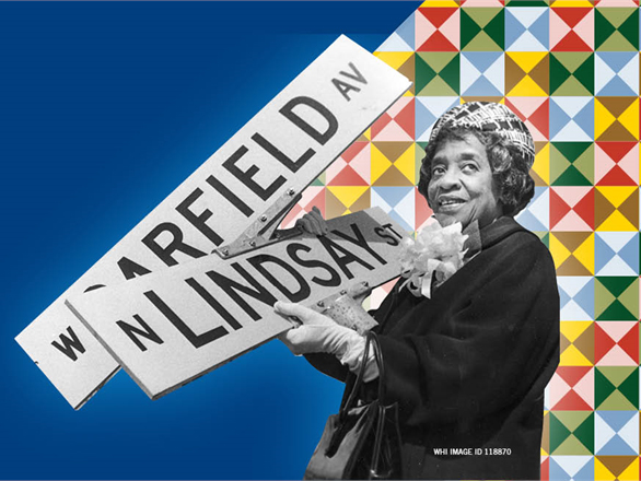 African American Woman with street signs, and a quilt in the background