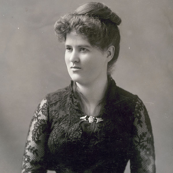 Formal studio portrait of Belle Case La Follette wearing a black lace dress. This photograph was taken about 1885, the year in which her husband, Robert M. La Follette, Sr., first went to Washington, D.C., as a Republican congressman. It is probably a dress that she wore to official parties and gatherings in the capital.