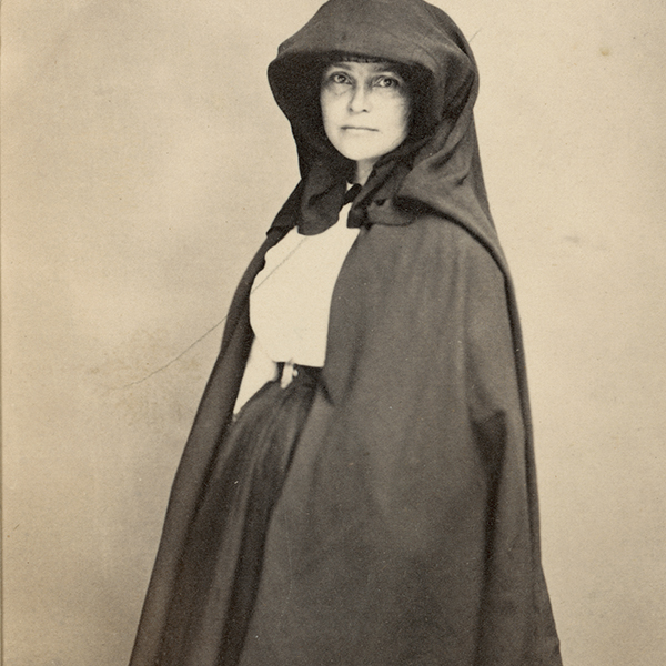 Carte-de-visite portrait of Cordelia Harvey wearing a hooded cape.