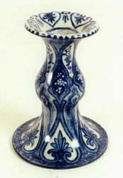 Art pottery candleholder, candlestick, stoneware, blue medallion, spade, and fan design.